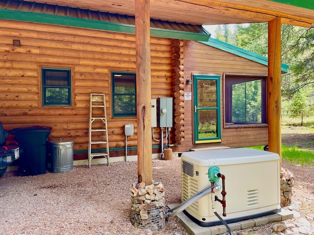 30 Williams Gulch Loop, Philipsburg, MT 59858 - view of front facade with log siding and a metal roof