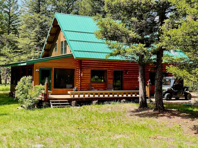 30 Williams Gulch Loop, Philipsburg, MT 59858 - view of front facade featuring log siding, a metal roof, and a porch