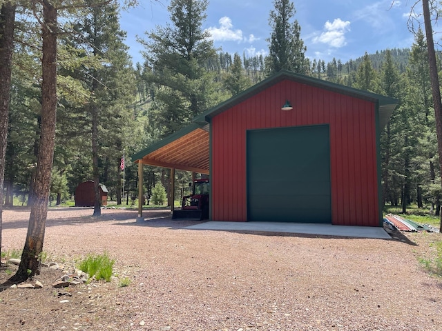 30 Williams Gulch Loop, Philipsburg, MT 59858 - view of outbuilding with a wooded view and dirt driveway