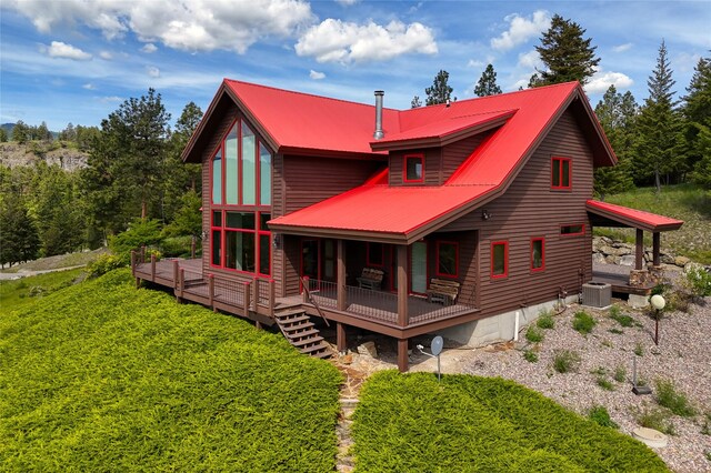 251 S Eighty Dr, Somers, MT 59932 - back of house with central AC unit, metal roof, and a deck