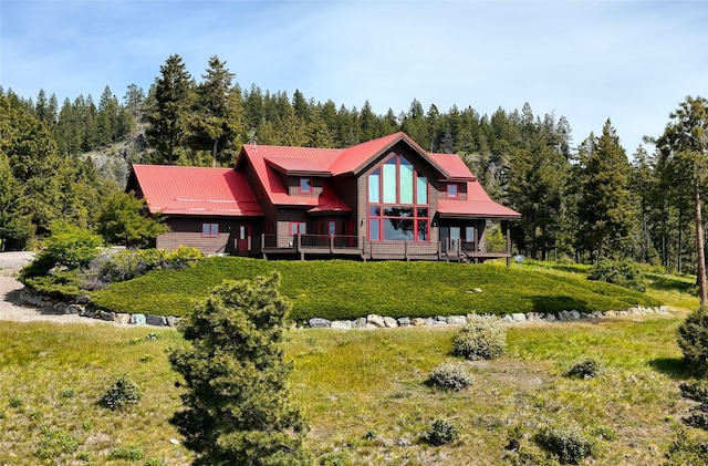 251 S Eighty Dr, Somers, MT 59932 - back of house featuring a view of trees and a metal roof