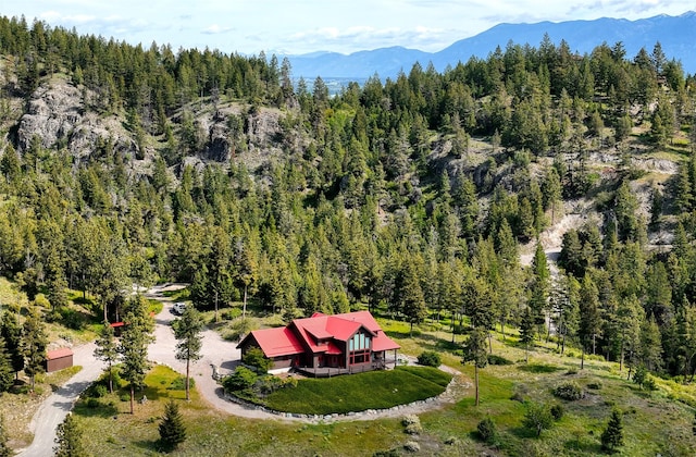 251 S Eighty Dr, Somers, MT 59932 - aerial view of property and surrounding area featuring a forest and a mountain backdrop