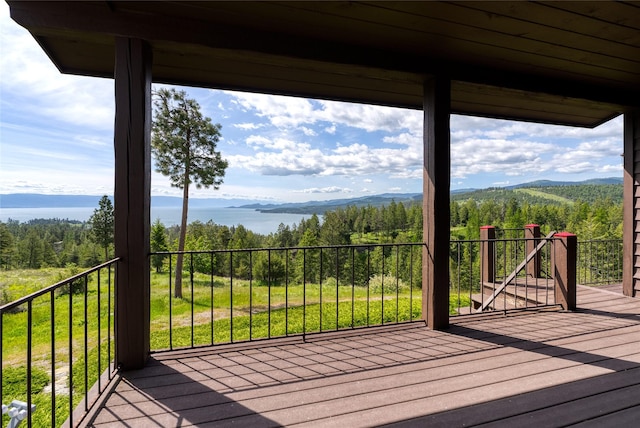 251 S Eighty Dr, Somers, MT 59932 - wooden deck featuring a mountain view and a view of trees