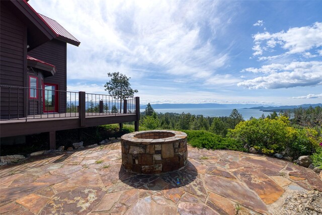 251 S Eighty Dr, Somers, MT 59932 - view of patio / terrace featuring an outdoor fire pit and a deck with mountain view