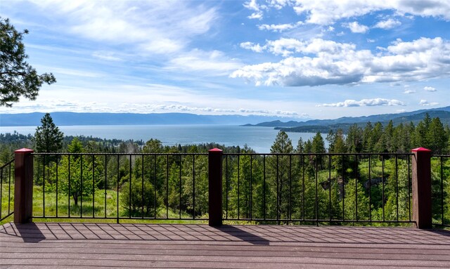 251 S Eighty Dr, Somers, MT 59932 - wooden terrace featuring a water and mountain view