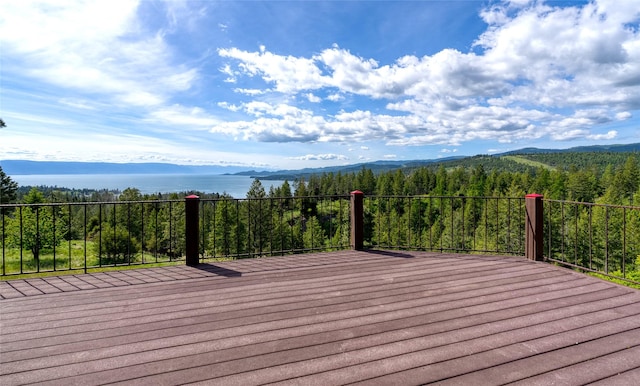 251 S Eighty Dr, Somers, MT 59932 - wooden deck with a mountain view and a view of trees
