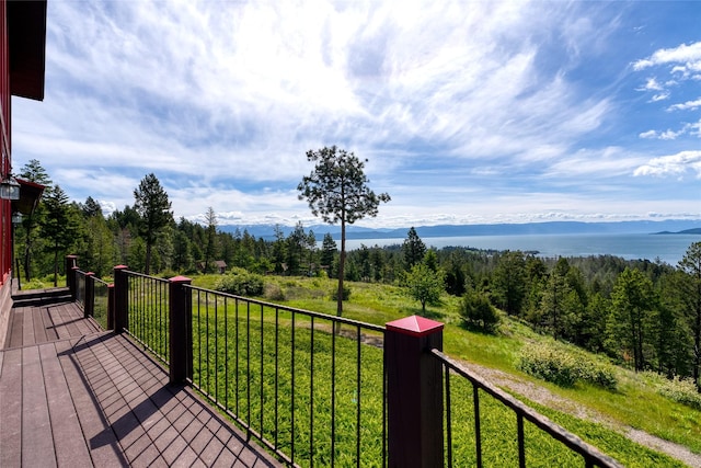 251 S Eighty Dr, Somers, MT 59932 - wooden terrace with a view of trees and a mountain view