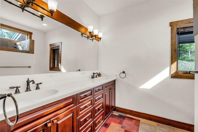 251 S Eighty Dr, Somers, MT 59932 - full bathroom with double vanity and baseboards