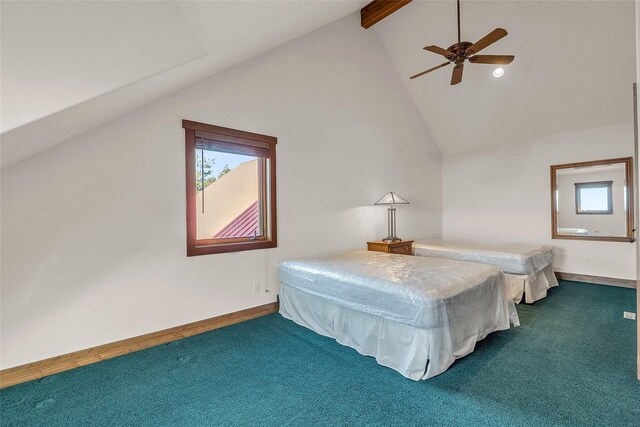 251 S Eighty Dr, Somers, MT 59932 - carpeted bedroom with beam ceiling, a ceiling fan, high vaulted ceiling, and baseboards