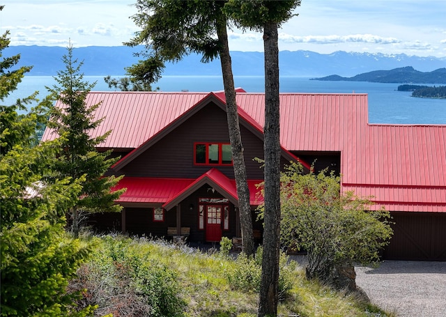 251 S Eighty Dr, Somers, MT 59932 - view of front of house with metal roof and a water and mountain view