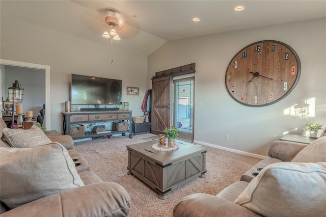 5946 Johnson Rd, East Helena, MT 59635 - living area with light carpet, a barn door, a ceiling fan, vaulted ceiling, and baseboards