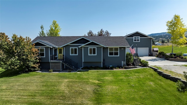 5946 Johnson Rd, East Helena, MT 59635 - ranch-style house featuring a garage, concrete driveway, a front yard, and a shingled roof