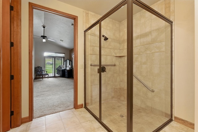 1112 Anglers Bend Way, Missoula, MT 59802 - full bath featuring vaulted ceiling, ceiling fan, a stall shower, tile patterned floors, and baseboards