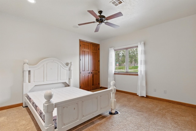 1112 Anglers Bend Way, Missoula, MT 59802 - bedroom with light carpet, baseboards, ceiling fan, and a closet