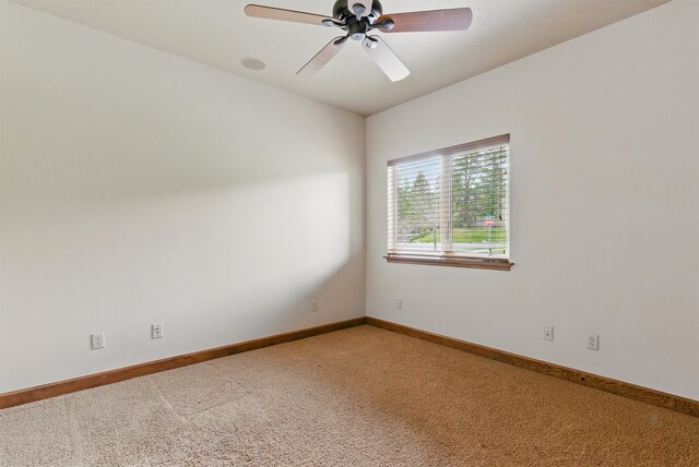 1112 Anglers Bend Way, Missoula, MT 59802 - unfurnished room with light colored carpet, ceiling fan, and baseboards