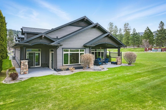 1112 Anglers Bend Way, Missoula, MT 59802 - back of house featuring a patio area and a yard