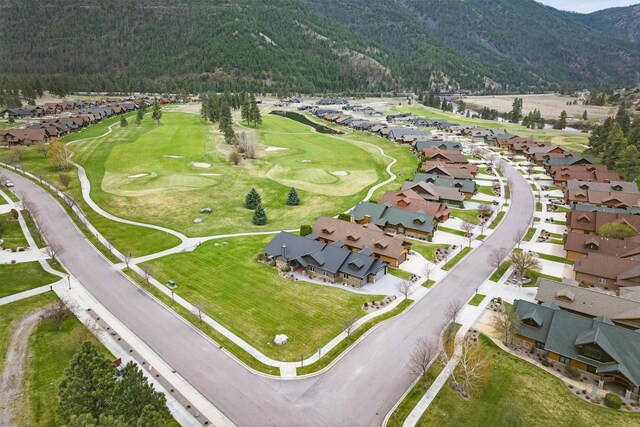 1112 Anglers Bend Way, Missoula, MT 59802 - aerial overview of property's location featuring mountains, nearby suburban area, a heavily wooded area, and a local golf course
