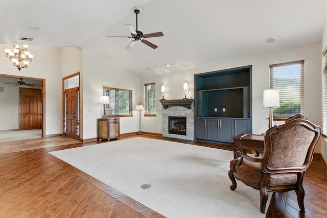 1112 Anglers Bend Way, Missoula, MT 59802 - living area with a ceiling fan, a chandelier, wood finished floors, plenty of natural light, and lofted ceiling