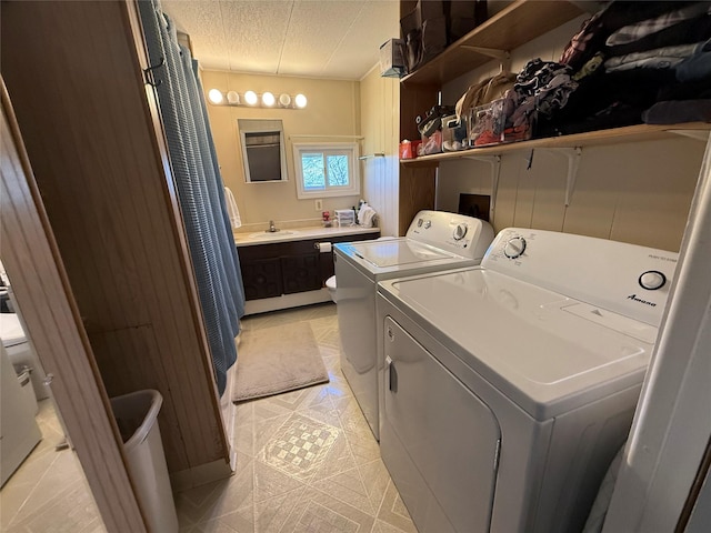 991 Phillips Rd, Helena, MT 59602 - washroom with washing machine and clothes dryer and a textured ceiling