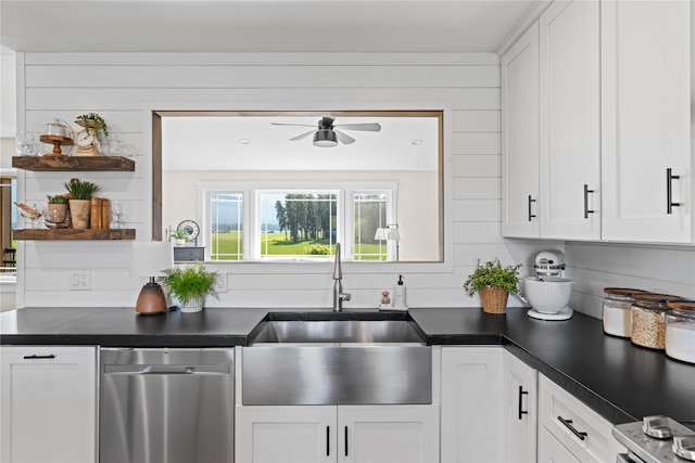 1683 Foxtail Dr, Kalispell, MT 59901 - kitchen with stainless steel dishwasher, open shelves, ceiling fan, dark countertops, and white cabinets