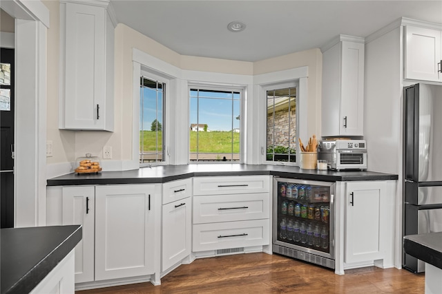 1683 Foxtail Dr, Kalispell, MT 59901 - kitchen featuring beverage cooler, stainless steel fridge, dark countertops, and white cabinets