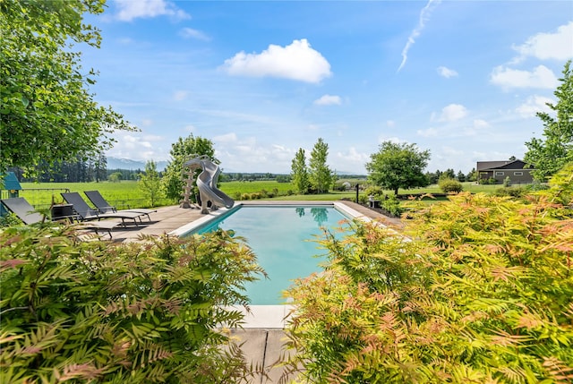 1683 Foxtail Dr, Kalispell, MT 59901 - swimming pool with a water slide and a patio area