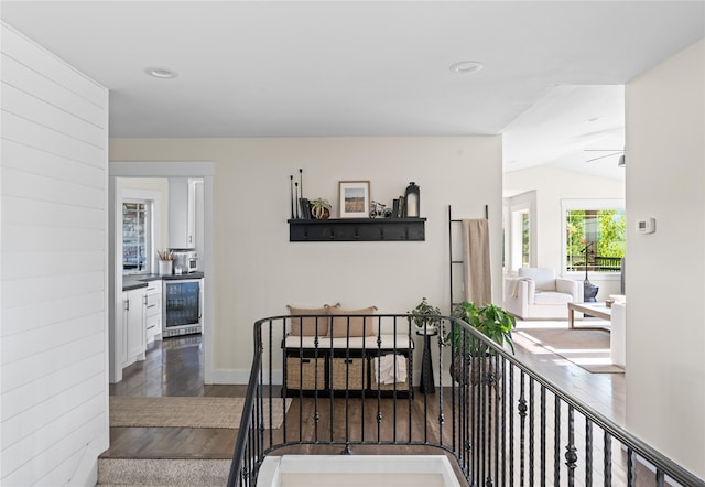 1683 Foxtail Dr, Kalispell, MT 59901 - dining area featuring wood finished floors, beverage cooler, recessed lighting, and vaulted ceiling