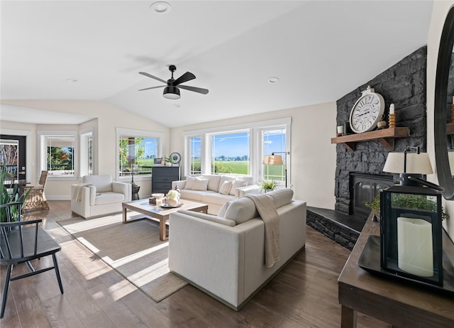 1683 Foxtail Dr, Kalispell, MT 59901 - living room with vaulted ceiling, a ceiling fan, dark wood finished floors, and a fireplace