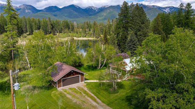 221 Kauffman Ln, Kalispell, MT 59901 - aerial view of property and surrounding area with a heavily wooded area and a water and mountain view
