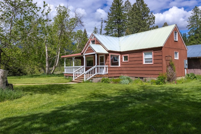 221 Kauffman Ln, Kalispell, MT 59901 - view of front of property with a front lawn and a metal roof