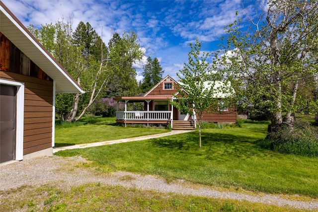221 Kauffman Ln, Kalispell, MT 59901 - view of grassy yard with a porch