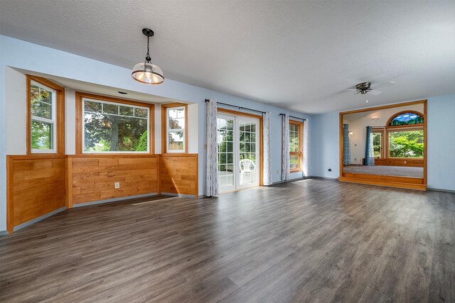 33958 Connolly Way, Polson, MT 59860 - empty room featuring wood finished floors, plenty of natural light, a textured ceiling, and ceiling fan