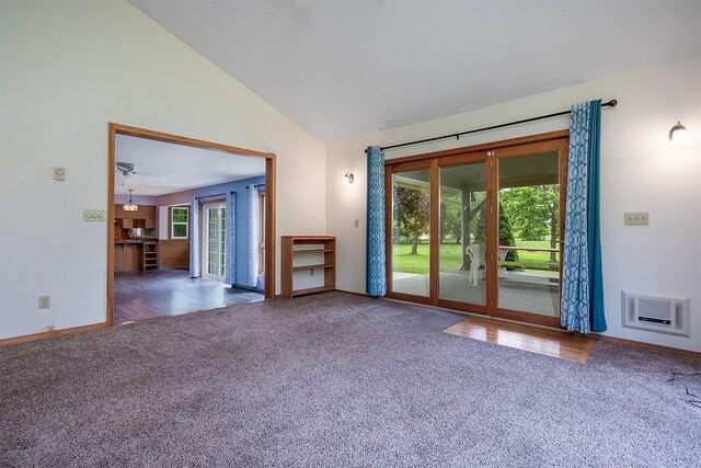 33958 Connolly Way, Polson, MT 59860 - unfurnished living room featuring carpet floors, vaulted ceiling, and french doors