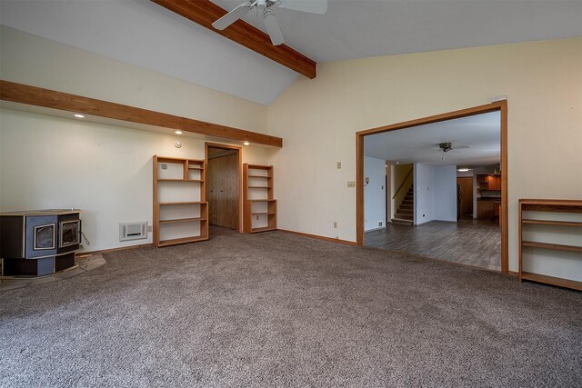33958 Connolly Way, Polson, MT 59860 - unfurnished living room with ceiling fan, stairs, carpet, a wood stove, and recessed lighting