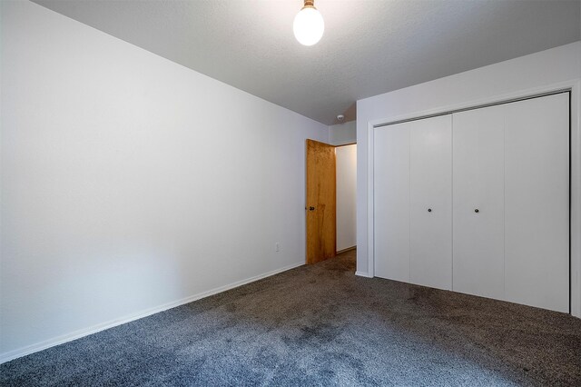 33958 Connolly Way, Polson, MT 59860 - unfurnished bedroom featuring carpet and a closet