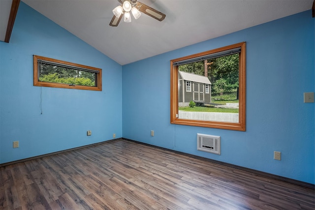 33958 Connolly Way, Polson, MT 59860 - unfurnished room featuring wood finished floors, a ceiling fan, lofted ceiling, and a wall unit AC