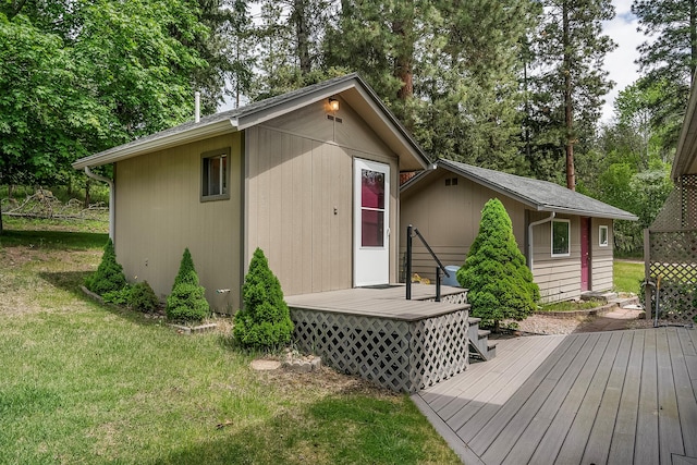33958 Connolly Way, Polson, MT 59860 - deck with a yard, view of scattered trees, and an outbuilding
