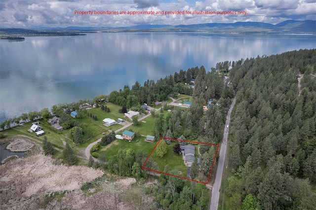 33958 Connolly Way, Polson, MT 59860 - aerial overview of property's location featuring property boundaries highlighted and a water and mountain view