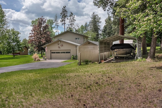 33958 Connolly Way, Polson, MT 59860 - view of front facade featuring driveway, a garage, and a carport
