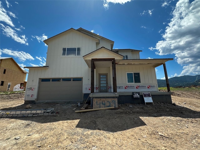 4429 Harrison Scott Dr, Missoula, MT 59803 - view of front of home featuring driveway, an attached garage, and board and batten siding