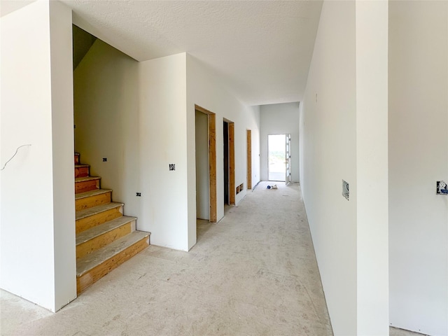 4429 Harrison Scott Dr, Missoula, MT 59803 - hallway featuring light carpet and stairs