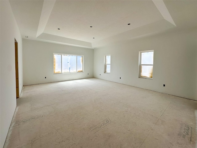 4429 Harrison Scott Dr, Missoula, MT 59803 - unfurnished room with a raised ceiling and plenty of natural light