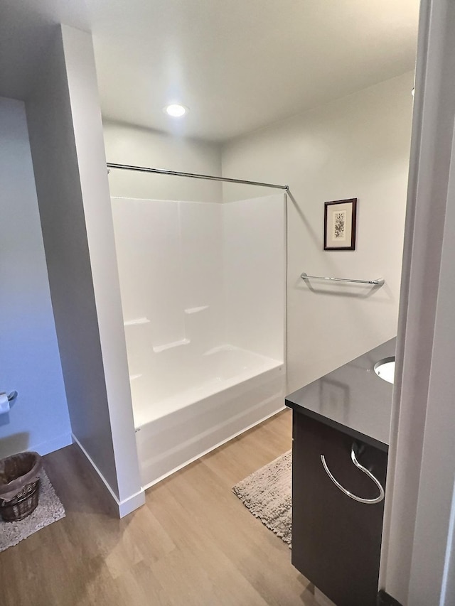 100 Woodlands Way Unit W-204, Kalispell, MT 59901 - full bathroom featuring wood finished floors, vanity, shower / tub combination, and recessed lighting
