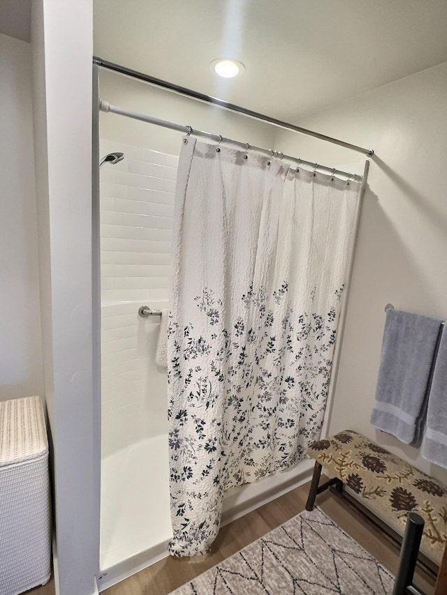 100 Woodlands Way Unit W-204, Kalispell, MT 59901 - bathroom featuring wood finished floors, shower / bath combo, and recessed lighting