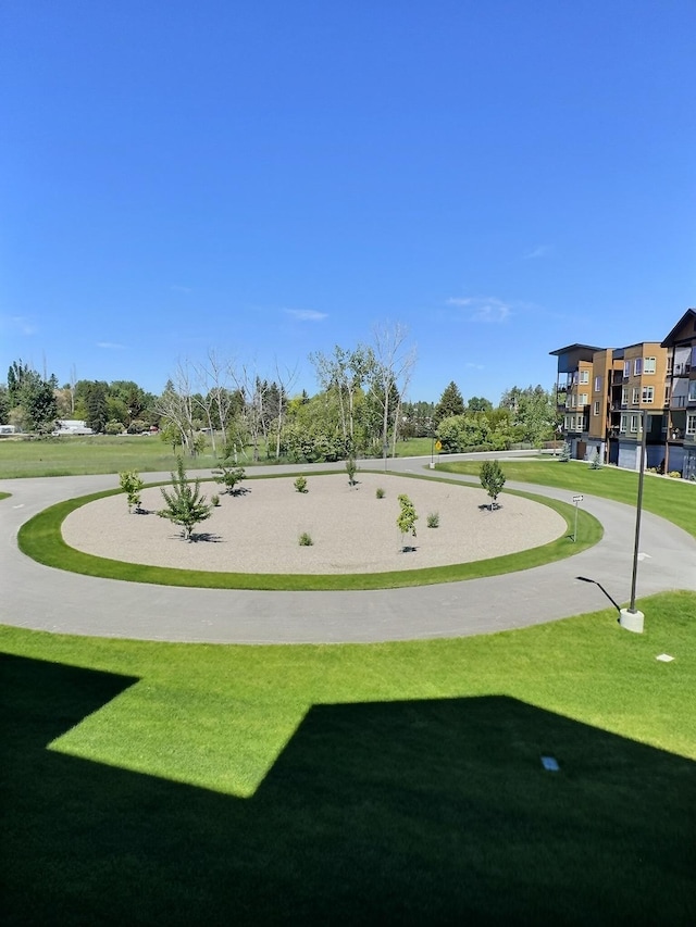 100 Woodlands Way Unit W-204, Kalispell, MT 59901 - surrounding community with a lawn