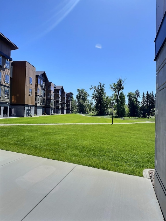 100 Woodlands Way Unit W-204, Kalispell, MT 59901 - view of property's community with a yard