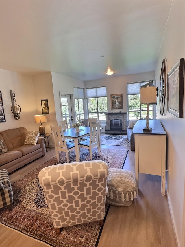 100 Woodlands Way Unit W-204, Kalispell, MT 59901 - living room featuring wood finished floors and a glass covered fireplace