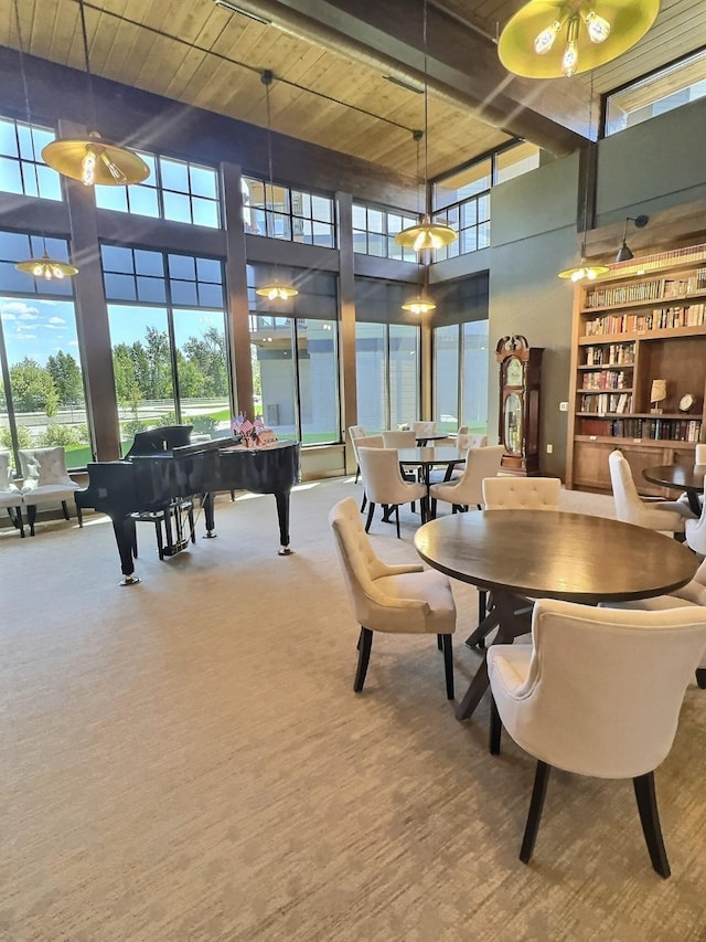 100 Woodlands Way Unit W-204, Kalispell, MT 59901 - rec room with a high ceiling, carpet, and wooden ceiling