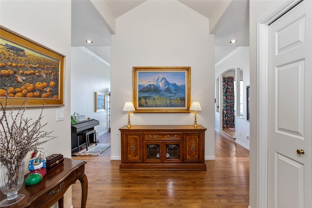 29137 Rocky Point Rd, Polson, MT 59860 - corridor featuring wood finished floors, baseboards, lofted ceiling, arched walkways, and recessed lighting