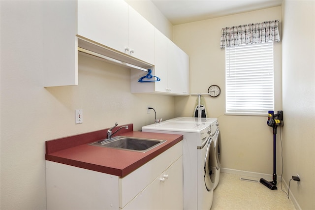 29137 Rocky Point Rd, Polson, MT 59860 - laundry area featuring baseboards, cabinet space, plenty of natural light, and washer and dryer